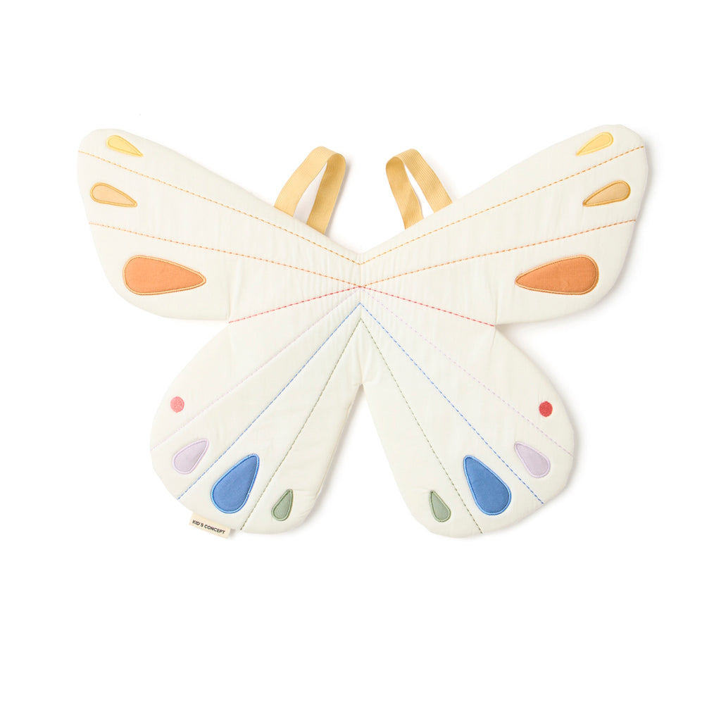 Quilted white butterfly-shaped costume with pastel orange, blue, and purple accents on wings. Features tan straps, creating a playful, whimsical tone.