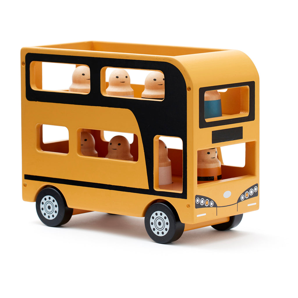 Wooden toy double-decker bus in yellow and black with small wooden passengers. The design is minimalist and playful, conveying a cheerful tone.