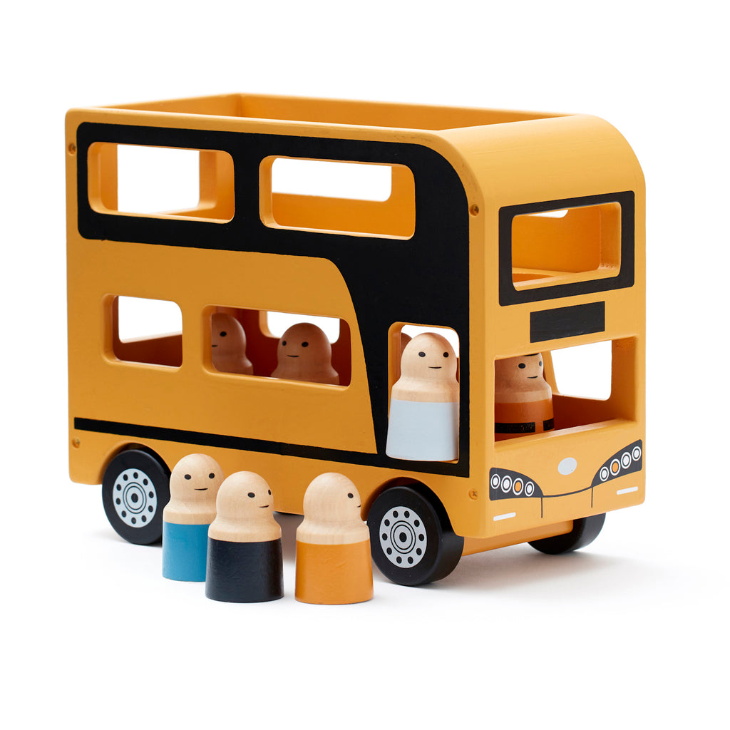 Toy wooden double-decker bus in yellow and black with smiling peg passengers inside and in front, evokes playfulness and joy.