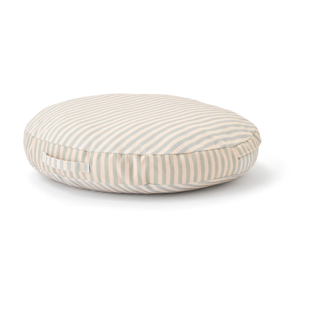 Round cushion with beige and gray horizontal stripes on a white background. The cushion has a calm, minimalist design, and includes a side handle.