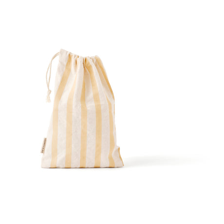 A yellow and white striped fabric drawstring bag standing against a white background.