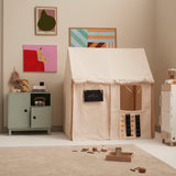 Off-white play house tent set up as a pretend store with an OPEN sign in a playroom.