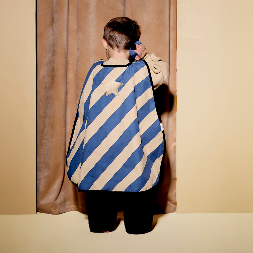 A stylish blue and beige striped cape with a gold star.