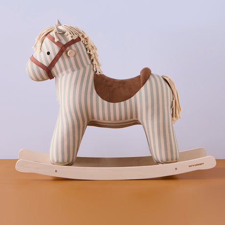 Side profile of a striped fabric rocking horse toy with a brown saddle on wooden runners.