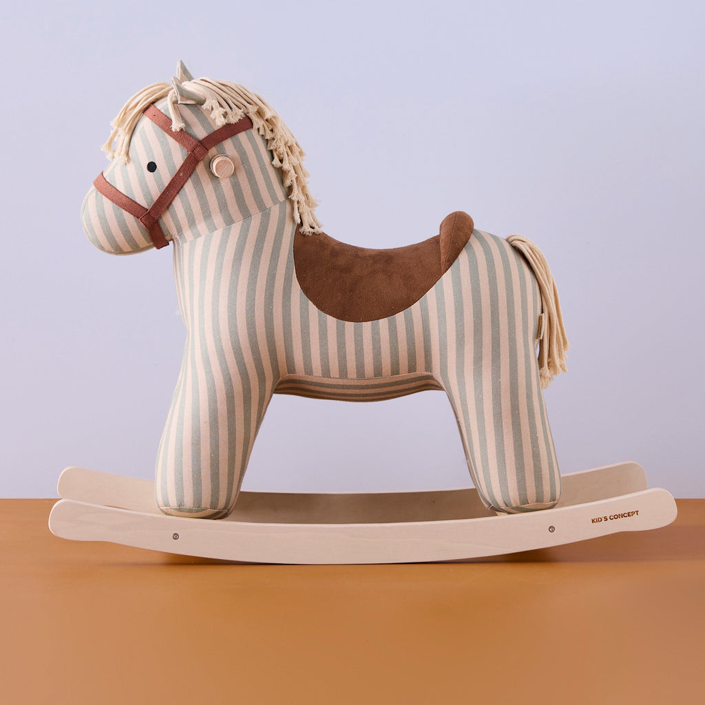 Soft, striped rocking horse with a beige and blue pattern, wooden rockers, and a plush brown saddle. It evokes a playful, nostalgic feel.
