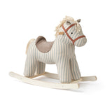Striped plush rocking horse toy with a brown saddle on a light wooden frame.
