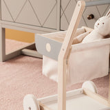 Wooden toy shopping trolley with a stuffed bunny sitting inside the fabric basket.