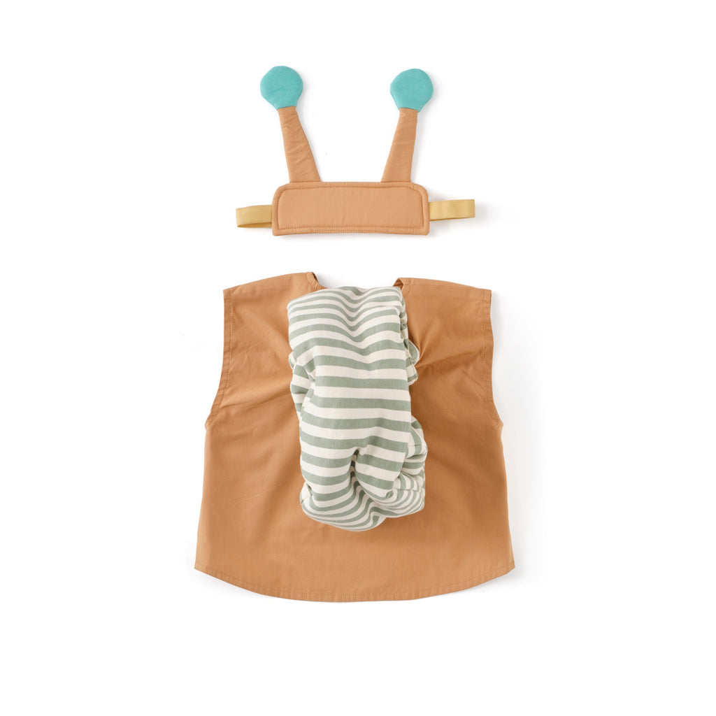 Beige children's costume resembling a snail, featuring a green striped spiral shell, brown body, and a headband with blue antennae. Playful and imaginative.