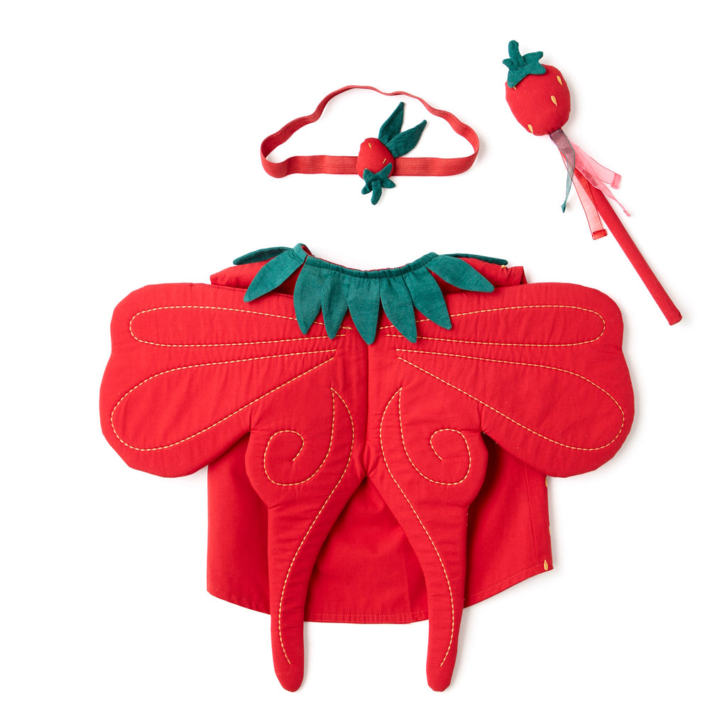 A vibrant red strawberry-themed costume set. It features a vest with green leaf accents and yellow seed details, a matching headband, and a wand. Perfect for playful dress-up.