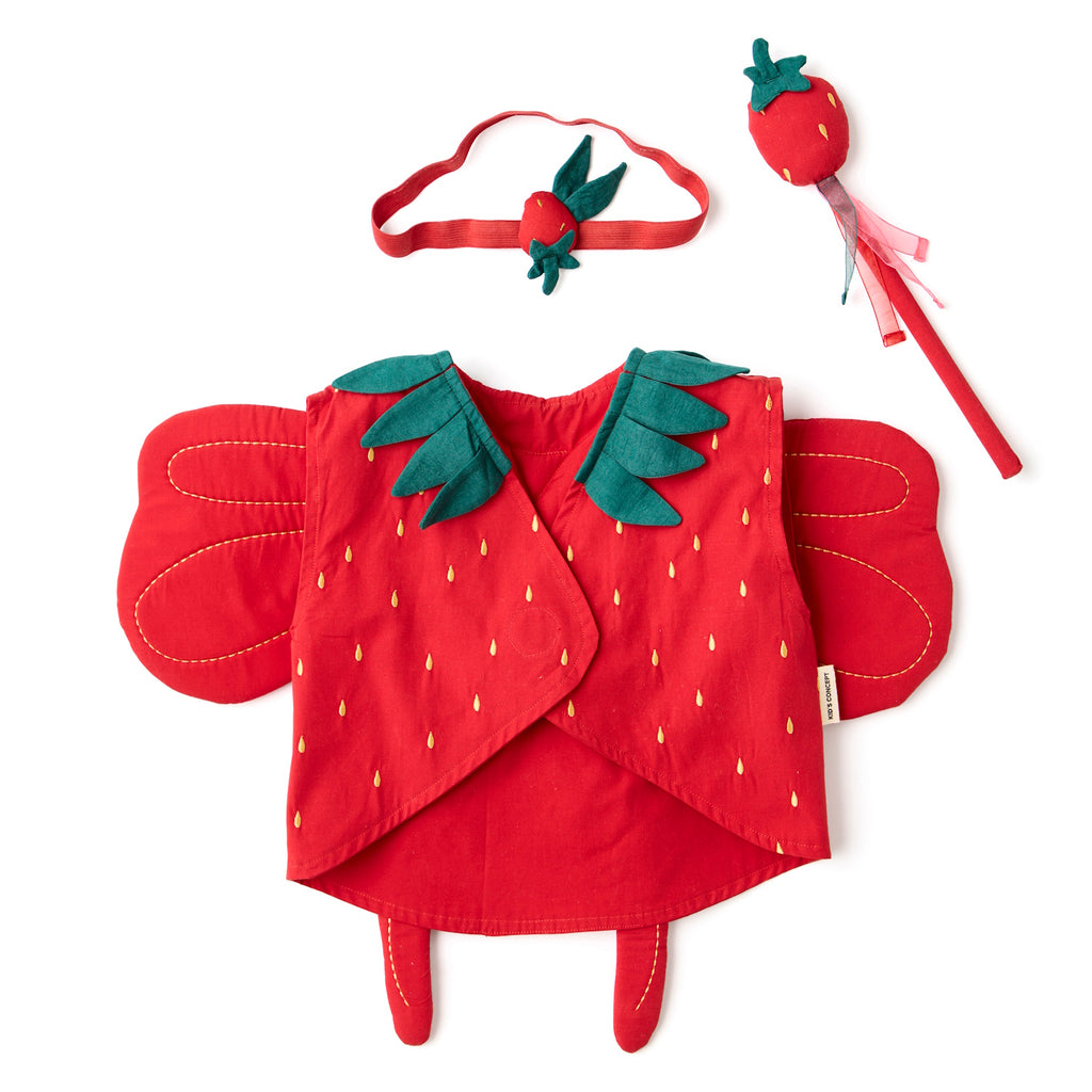 A vibrant red strawberry-themed costume set. It features a vest with green leaf accents and yellow seed details, a matching headband, and a wand. Perfect for playful dress-up.