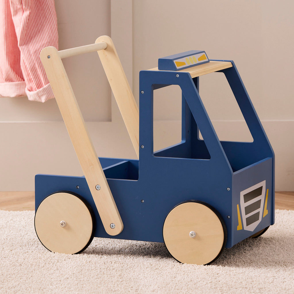 Wooden toy car with a blue body and natural wood accents, featuring four wheels and a handle at the back for pushing. The design is simple and playful.