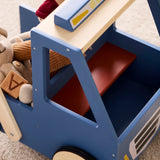 Front-angle view of a blue wooden toy walker truck carrying stuffed animals and wooden blocks.
