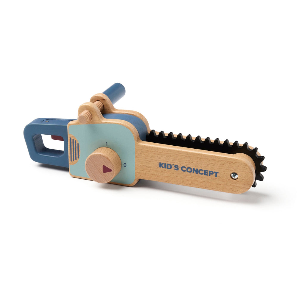 Wooden toy chainsaw with blue handle and details, featuring a rotating knob and black ridged edge. "Kid’s Concept" is printed on the side.