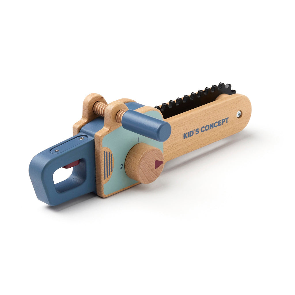 Wooden toy chainsaw with blue handle and details, featuring a rotating knob and black ridged edge. "Kid’s Concept" is printed on the side.
