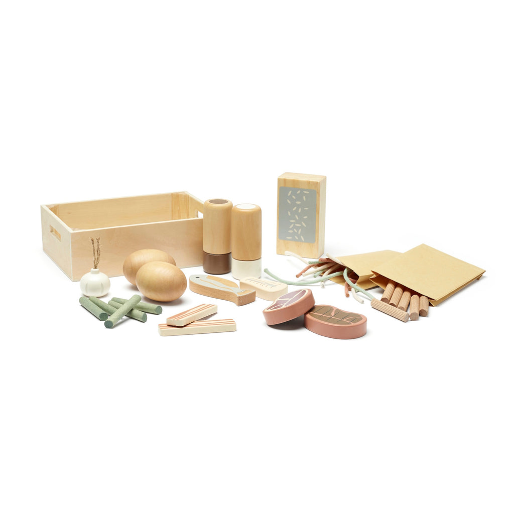 A wooden toy sushi set with chopsticks, soy sauce bottles, fish pieces, and a box. Natural colors and textures evoke a playful, educational tone.