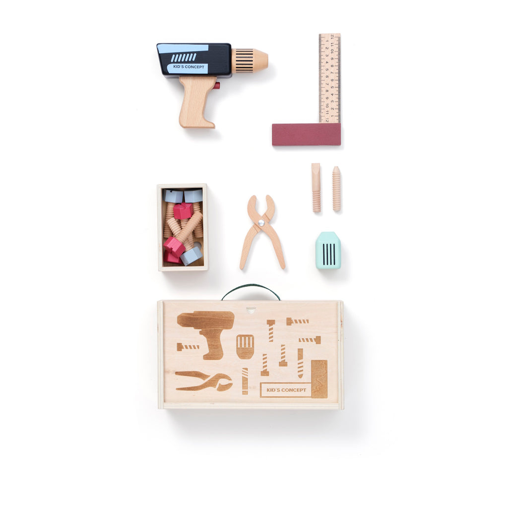 Wooden toy tool set with a drill, ruler, pliers, and screws, arranged in front of a toolbox on a white background, conveying creativity and play.