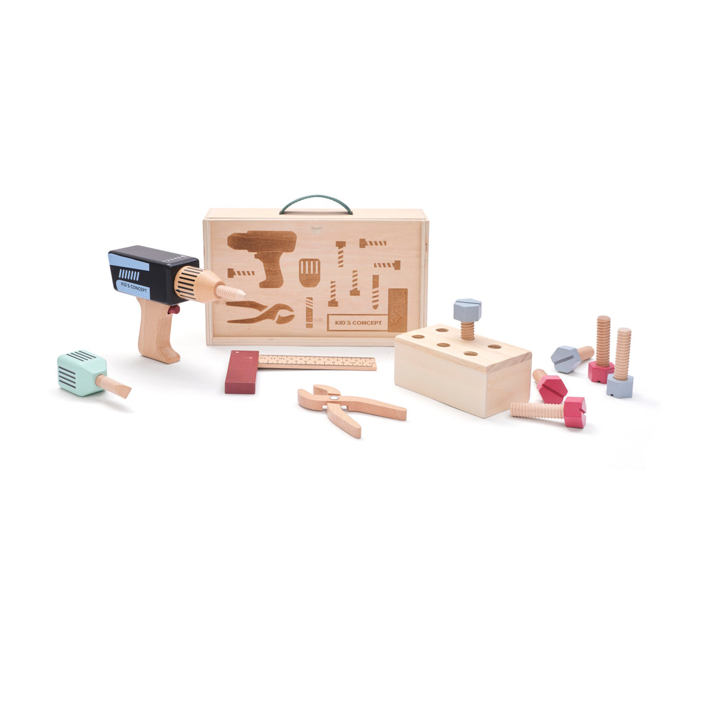 Wooden toy tool set with a drill, ruler, pliers, and screws, arranged in front of a toolbox on a white background, conveying creativity and play.