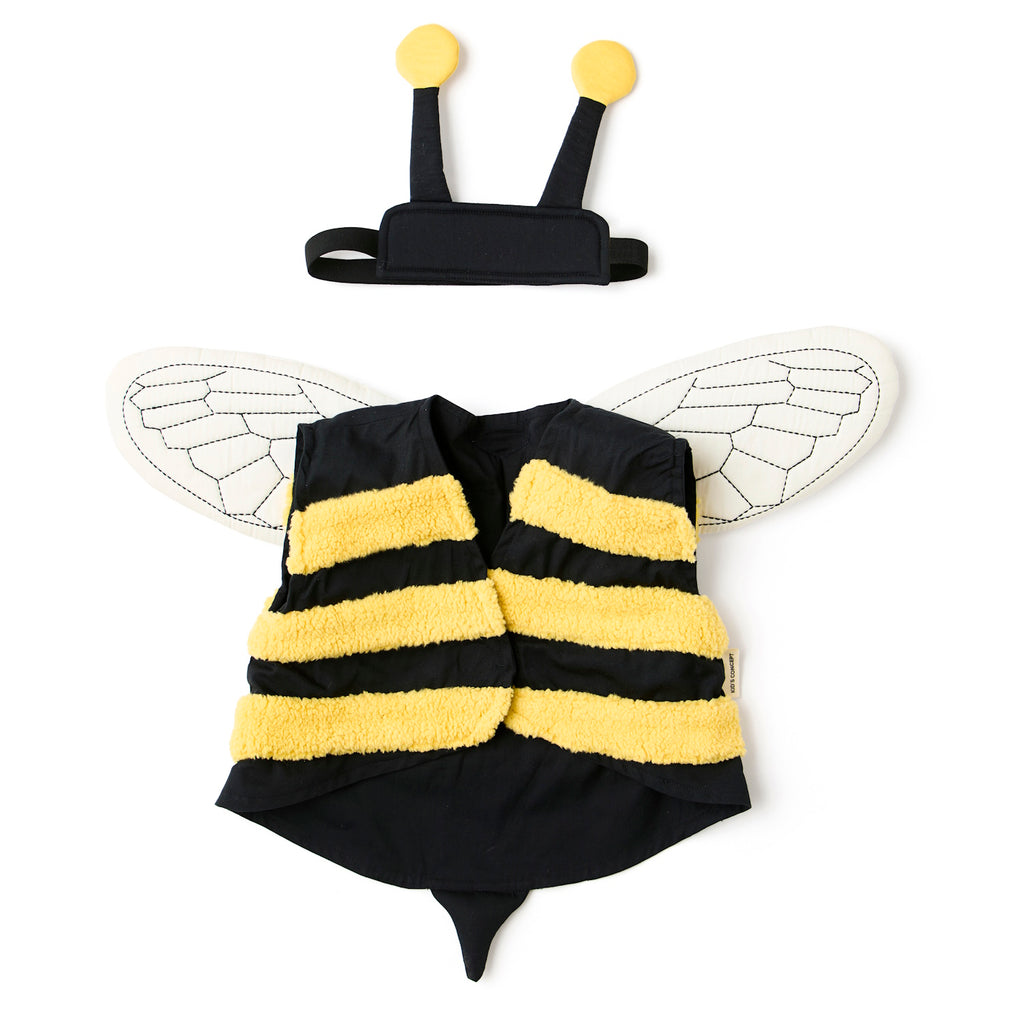A playful bee costume for pets featuring yellow and black stripes, translucent wings with vein details, and a black headband with yellow pom antennas.