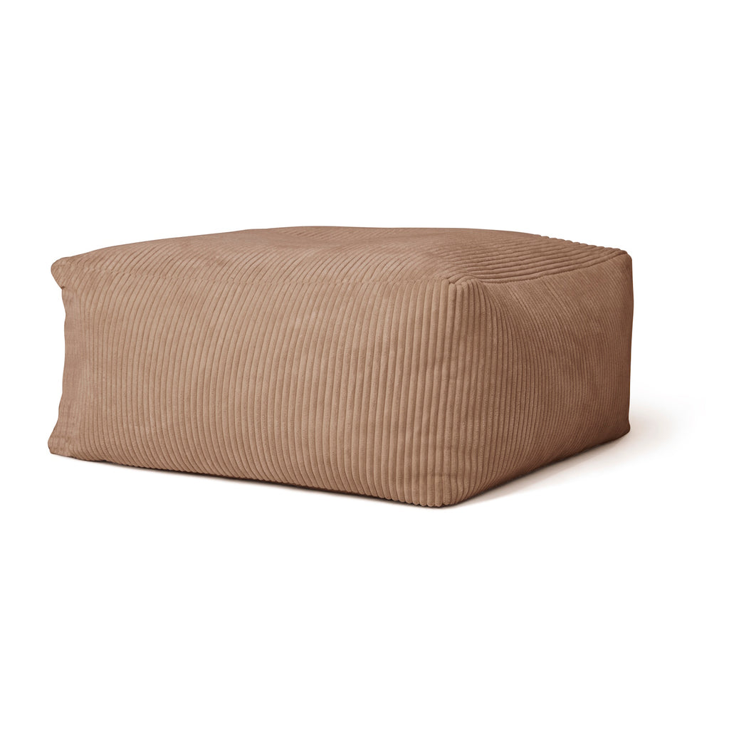 A plush, rectangular brown pouf with a ribbed texture. Its soft, inviting appearance suggests comfort, adding warmth to any room decor.