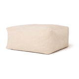 Square, off-white corduroy pouffe ottoman on a plain white background.