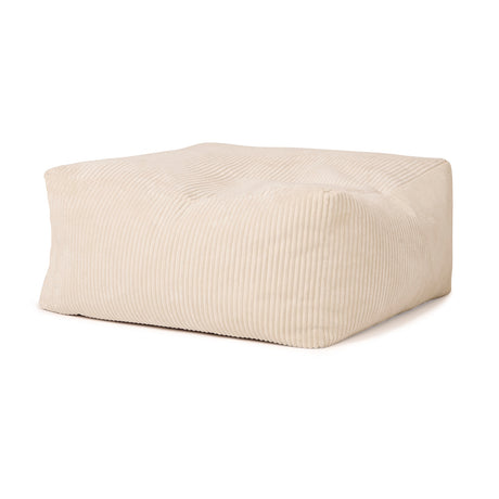 Off-white corduroy square pouffe ottoman centered on a plain white background.