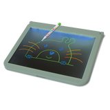A colorful pen rests on an illuminated drawing tablet, displaying a cute, simple illustration of a smiling animal face with whiskers and ears.