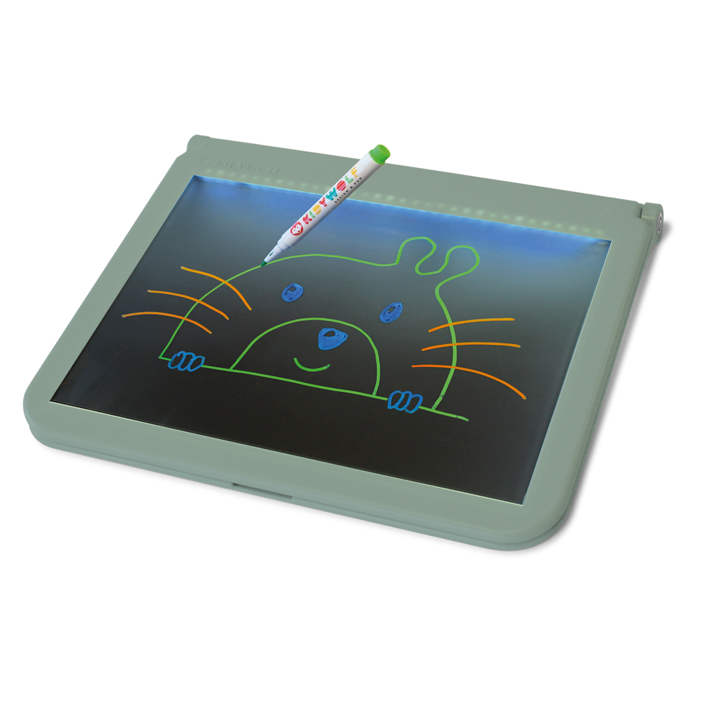A colorful pen rests on an illuminated drawing tablet, displaying a cute, simple illustration of a smiling animal face with whiskers and ears.