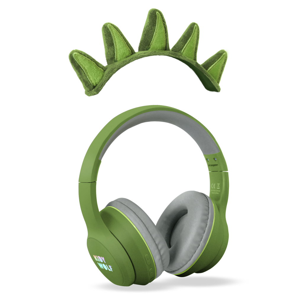 Green headphones with soft, gray ear cushions on a white background, featuring playful green dinosaur spikes on the headband, conveying a fun and quirky vibe.