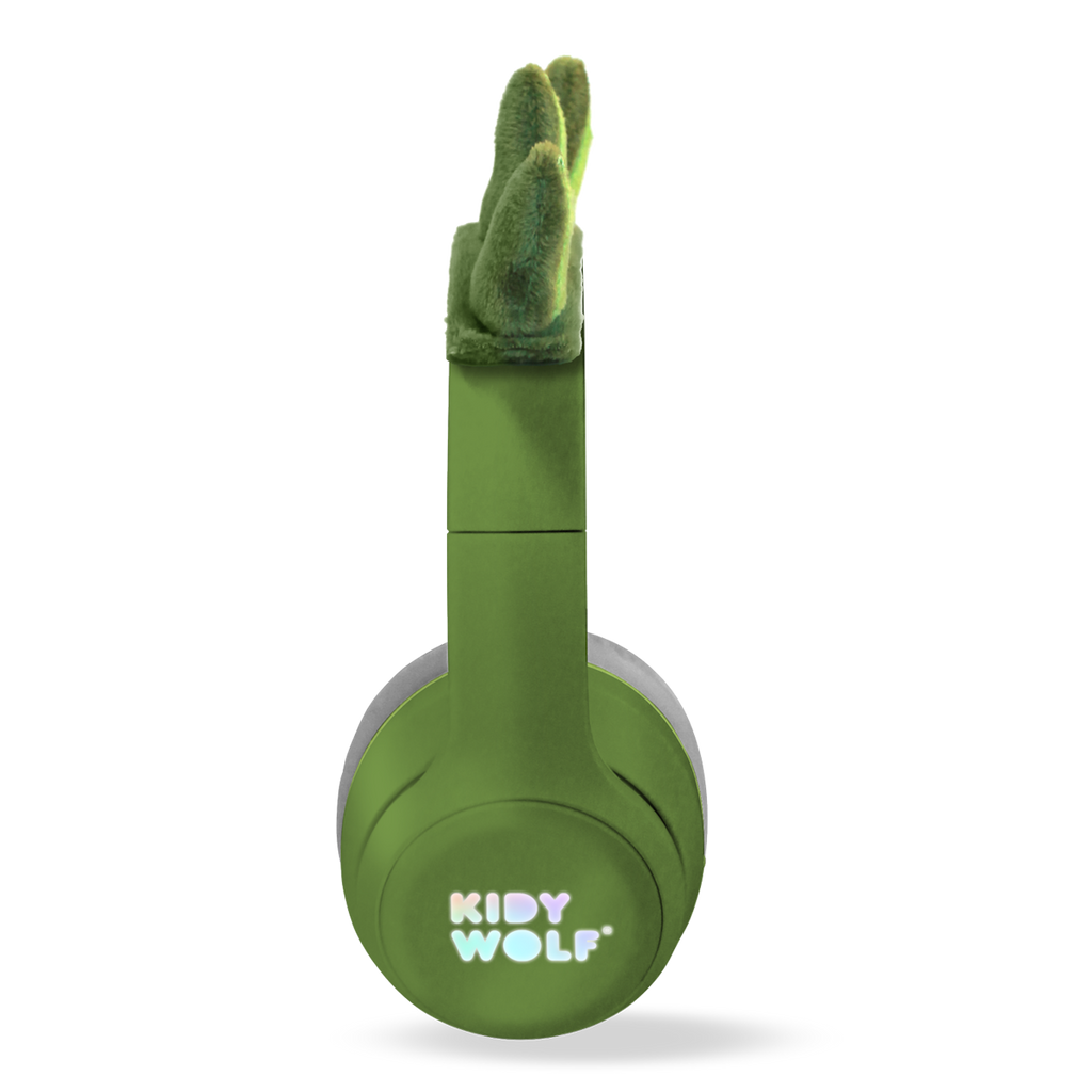 Green headphones with soft, gray ear cushions on a white background, featuring playful green dinosaur spikes on the headband, conveying a fun and quirky vibe.