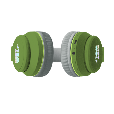 Green headphones with soft, gray ear cushions on a white background, featuring playful green dinosaur spikes on the headband, conveying a fun and quirky vibe.