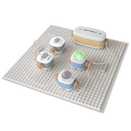Kidywolf electronic circuit toy set on a gray baseplate, featuring a lit-up green light module.