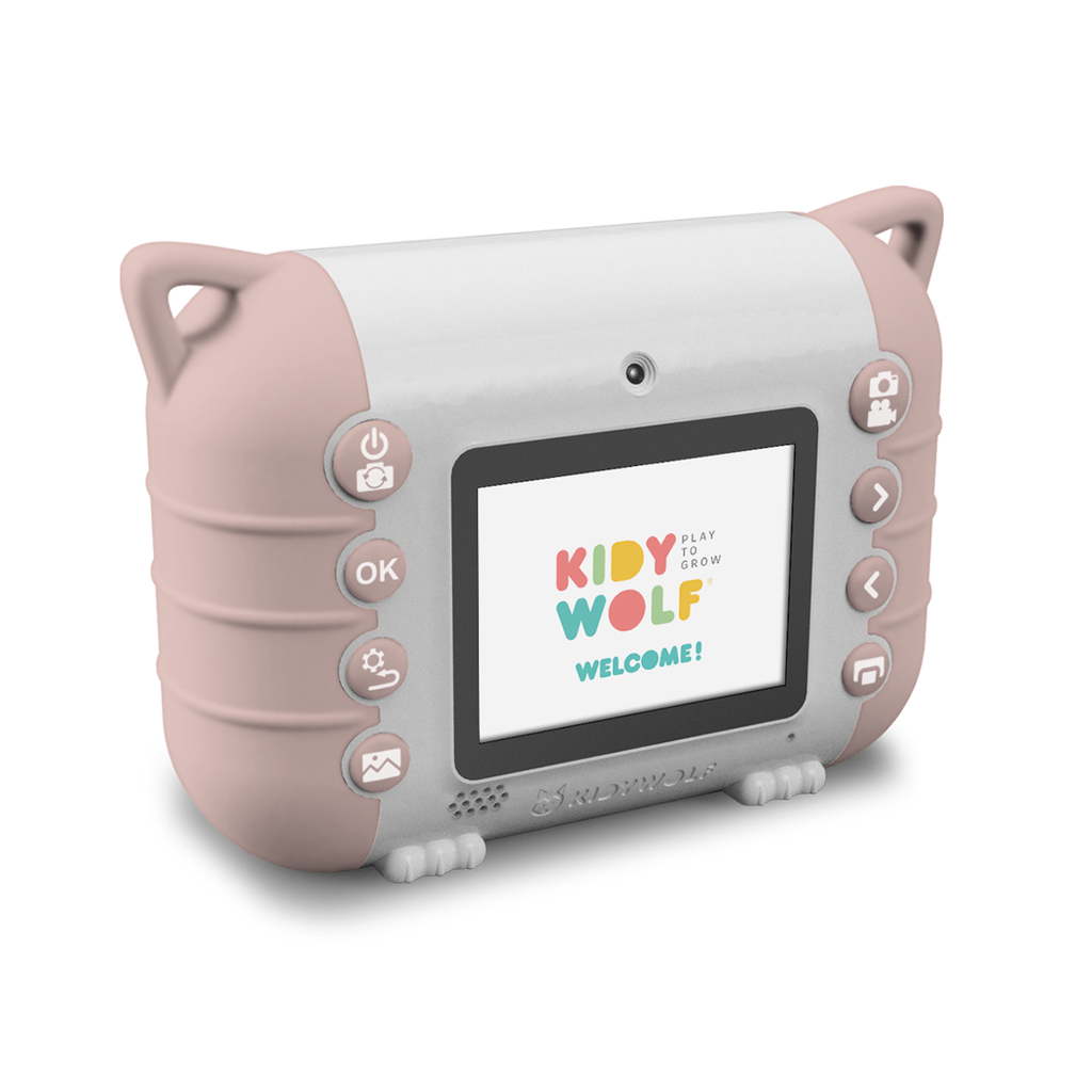 A children’s digital camera with a pink and white design is set against a white background. Its screen displays the colorful text “Kidy Wolf Welcome!” with various control buttons on the sides.