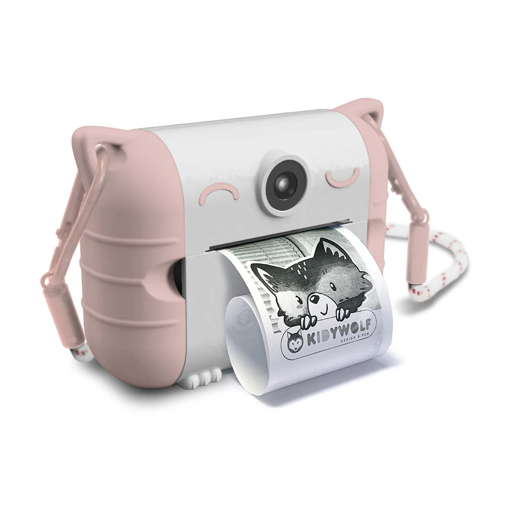 Cute pink and white toy camera with cat ears, printing a black and white photo of a child smiling. The design is playful and whimsical.