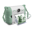 Cute white and mint green instant camera with cat ears prints a photo of a child making a playful face. The design is whimsical and fun.
