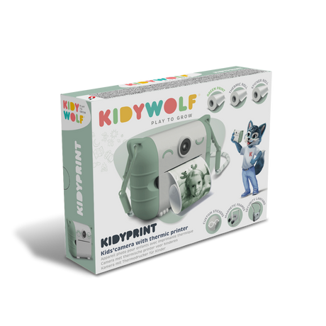 Kid's thermic printer camera packaging. Features a green camera printing a photo of a girl. Includes a cartoon wolf mascot. Bright and playful design.