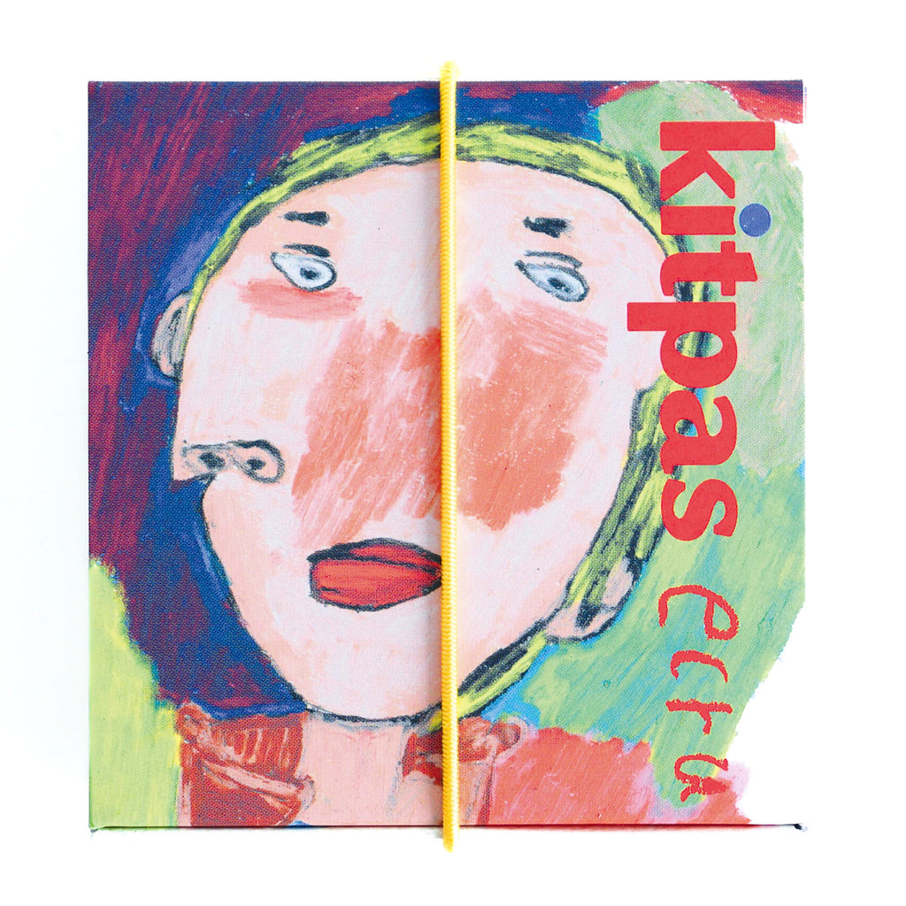 Close-up of an abstract face with exaggerated features in a mix of colors; a yellow line divides the image. "kitpas ecru" is in bold red text.