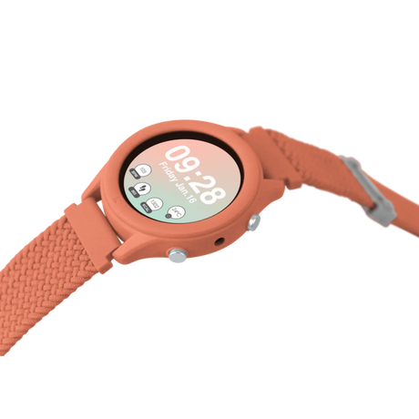 A coral-colored smartwatch with a woven strap showing the time and fitness metrics on a white background.