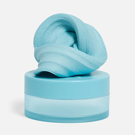 Swirled sky-blue focus putty sitting on top of its matching circular container.