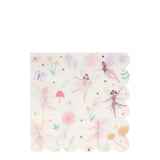 A scalloped paper napkin with a pastel pattern of dancing fairies, mushrooms, and flowers.