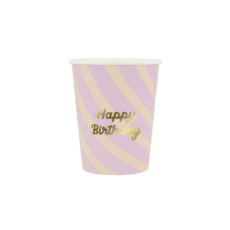 A pink and cream striped paper cup with gold text that reads "Happy Birthday."