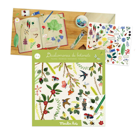 Botanical decal set with illustrated flowers, birds, and leaves on a table. An open notebook shows nature sketches, evoking creativity and exploration.