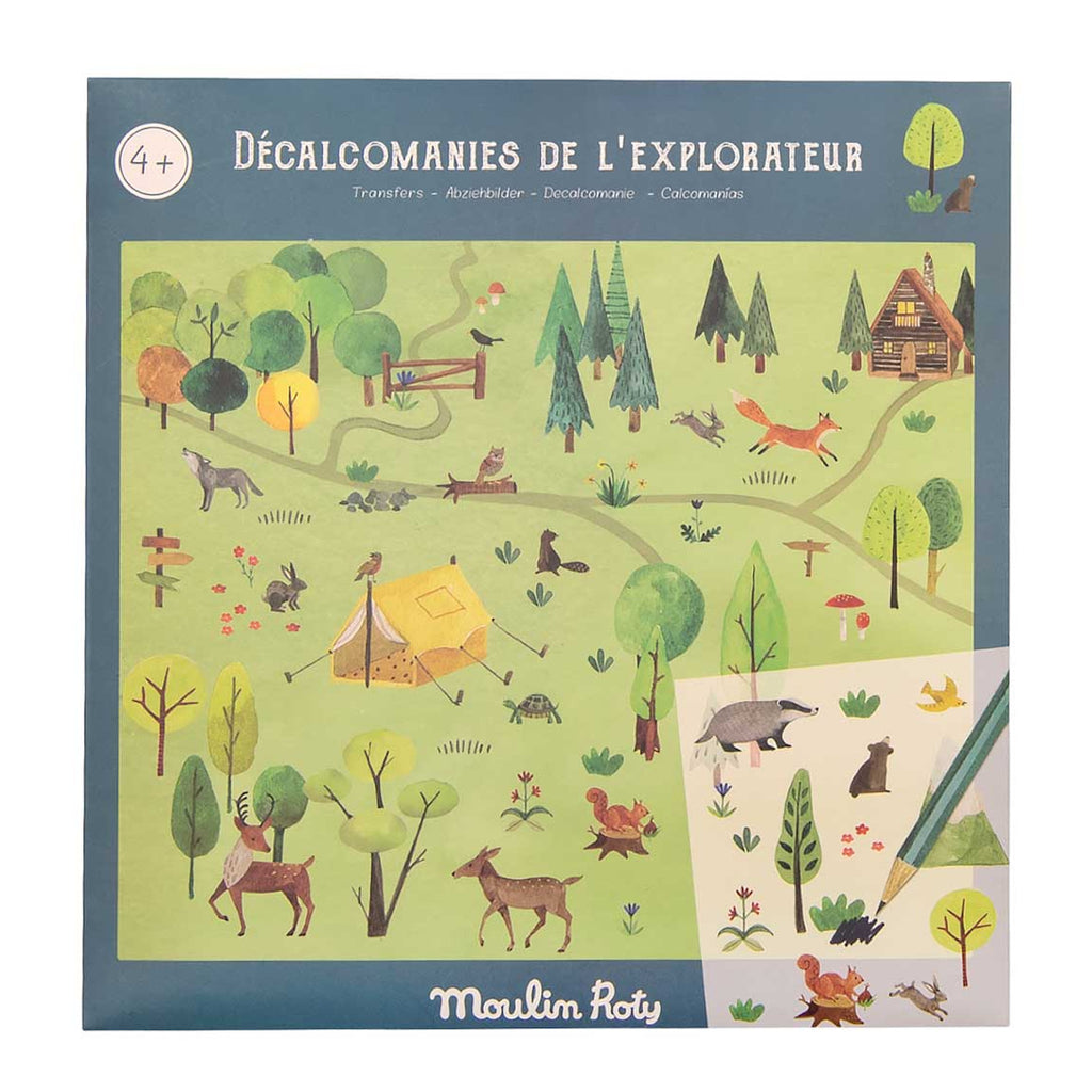 Illustrated nature scene depicting forests, animals, and a campsite. Includes foxes, deer, and a cabin. The cover says "Décalcomanies de l'Explorateur."