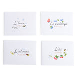 Four white cards depict the seasons in French and English. Each card features seasonal illustrations like snowflakes, flowers, leaves, and insects.