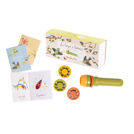 Children's storytelling kit with a green and orange flashlight, three colorful story discs, illustrated books, and vibrant packaging. Playful and imaginative.