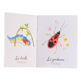 Moulin Roty Le Jardin du Moulin storybook torch insects booklet open to caterpillar and fire bug illustrated pages.