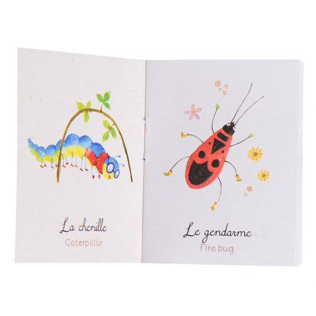 Moulin Roty Le Jardin du Moulin storybook torch insects booklet open to caterpillar and fire bug illustrated pages.