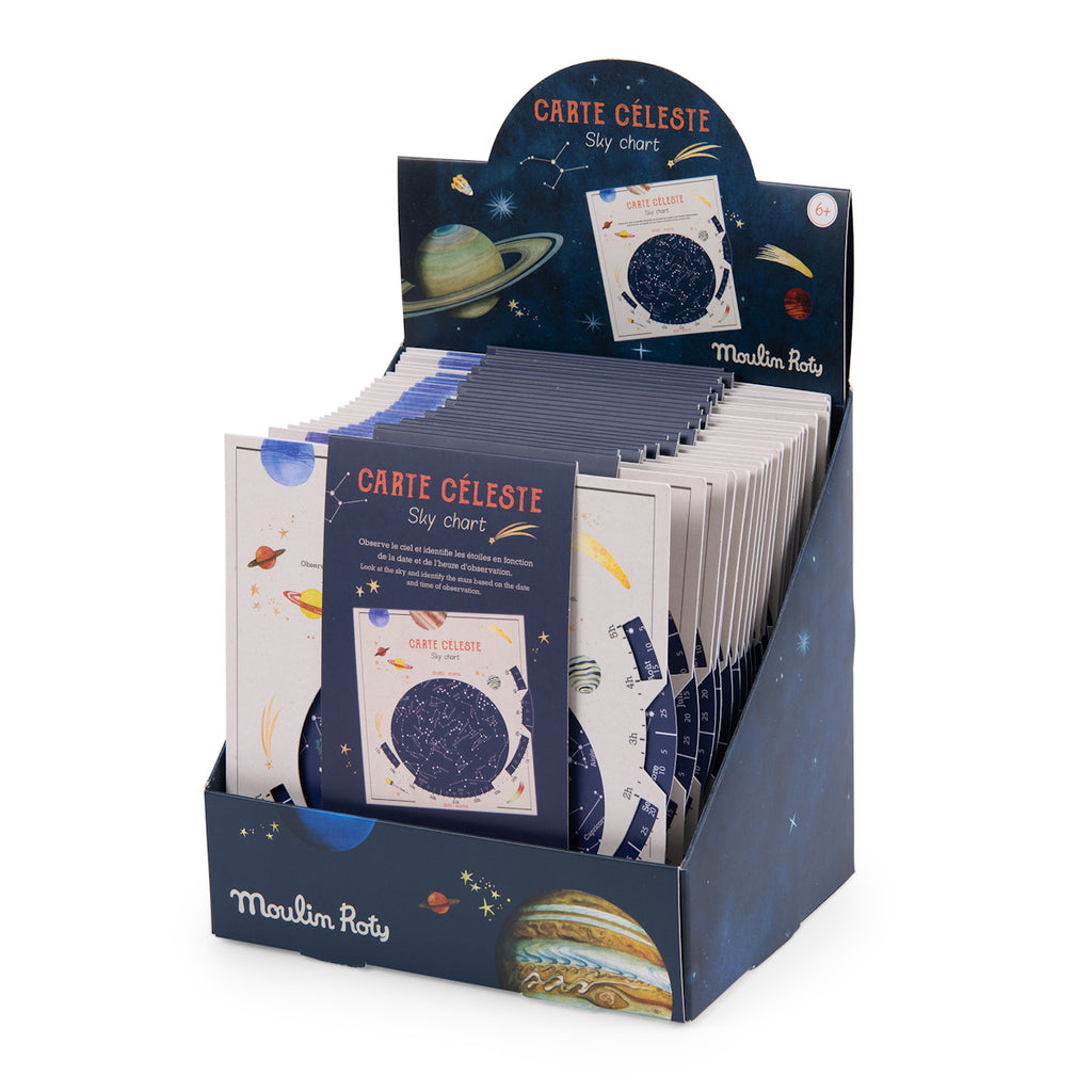 Counter display of "Carte Céleste Sky Chart" by Moulin Roty. Features space-themed graphics with planets and stars on the packaging, conveying an educational and whimsical tone.
