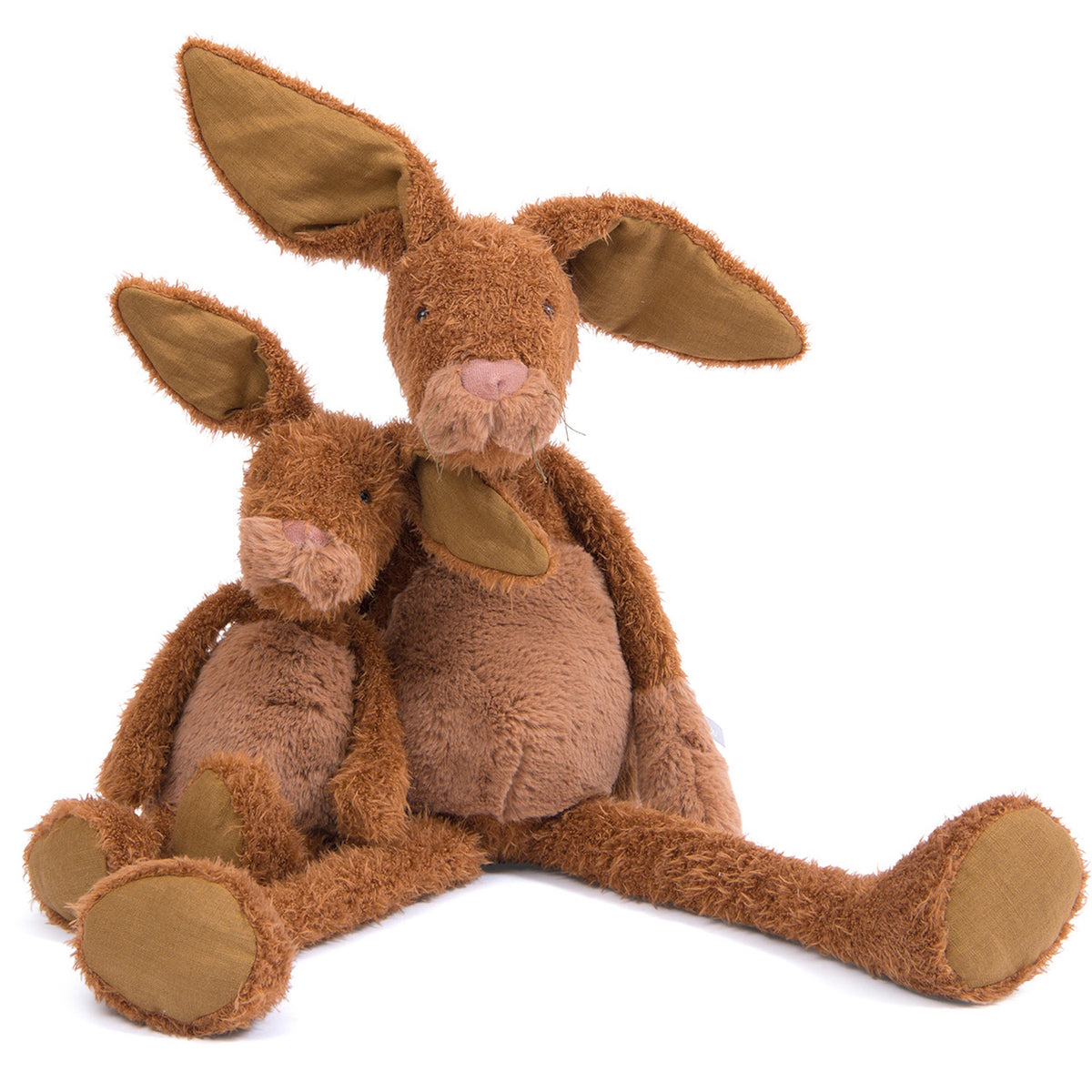 Two brown plush rabbits, one large and one small, sitting together with long limbs and floppy ears on a white background.