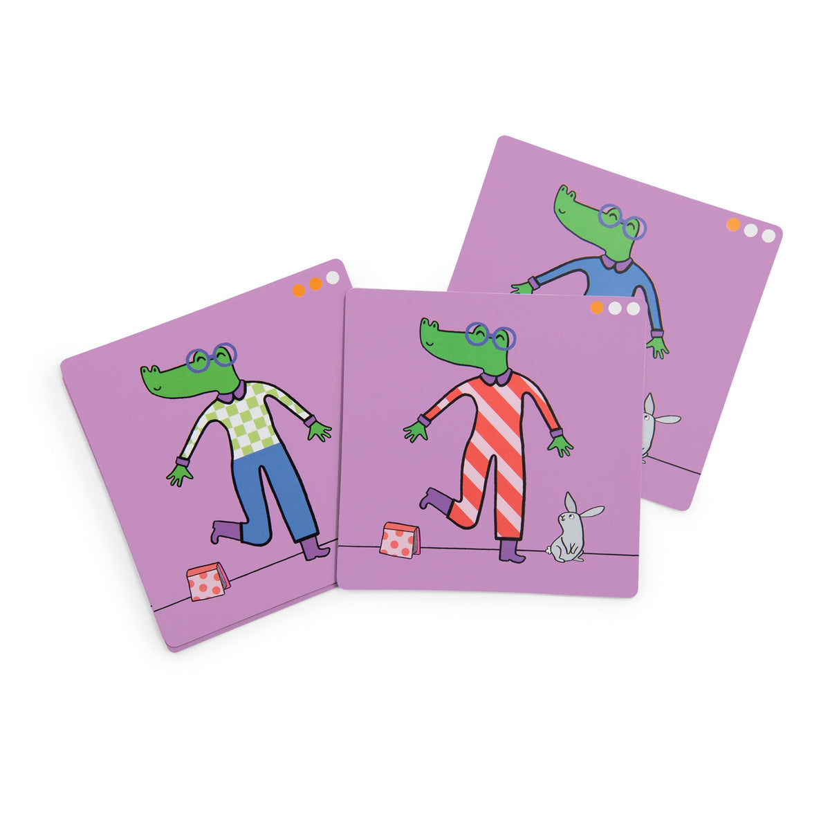Three illustrated mix-and-match logic game cards featuring a green crocodile character in different colorful outfits.