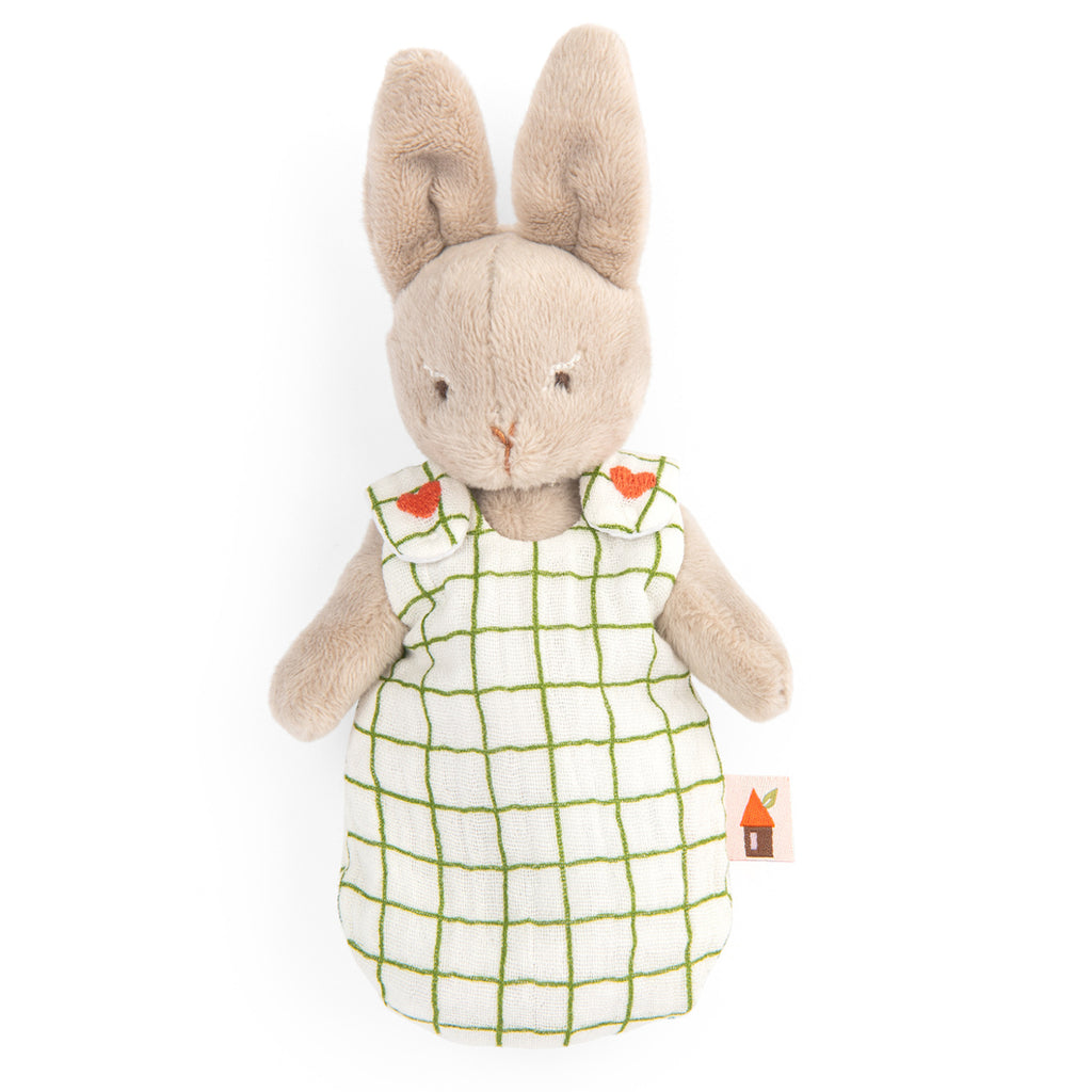 Soft plush bunny with beige fur, wearing a checkered green and white dress decorated with small heart accents. The tone is sweet and comforting.